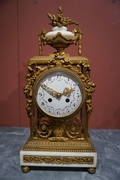 Louis XVI style Clock set in gilded bronze, France 2nd half 20th C.