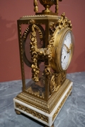 Louis XVI style Clock set in gilded bronze, France 2nd half 20th C.