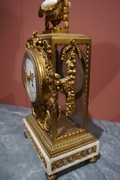 Louis XVI style Clock set in gilded bronze, France 2nd half 20th C.