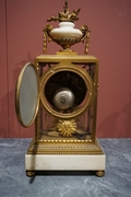 Louis XVI style Clock set in gilded bronze, France 2nd half 20th C.