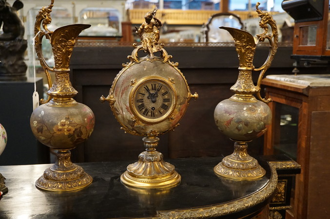 Pottery with brass Gustav Becker clock set