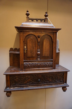 Small walnut curio cabinet