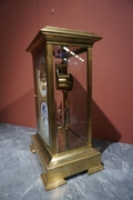 Table clock in Glass and gilded bronze , France 19th C.