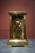 Table clock in Glass and gilded bronze , France 19th C.